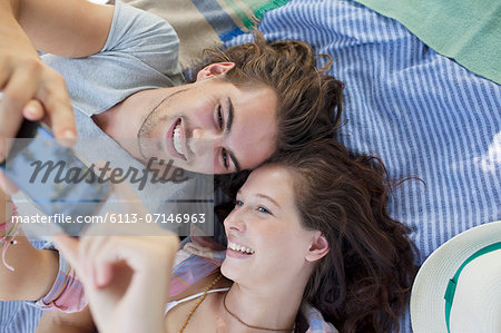 Couple taking self-portrait with camera phone