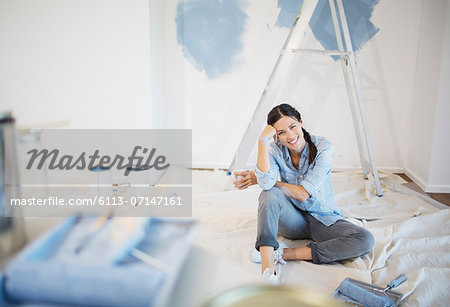Portrait of woman surrounded by paint supplies Portrait of woman surrounded by paint supplies