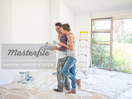 Couple painting walls