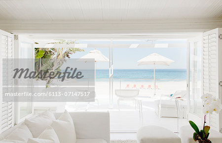 Modern living room overlooking beach and ocean