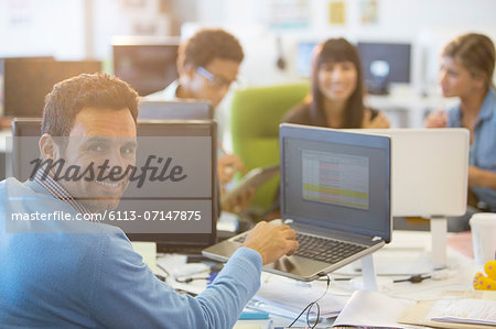 Businessman working at desk in office