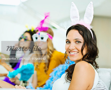 Woman wearing bunny ears at party