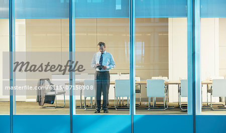 Businessman standing in conference room