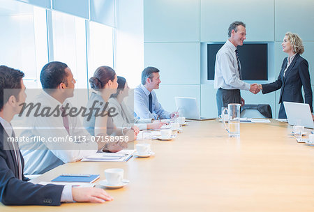 Business people shaking hands in office