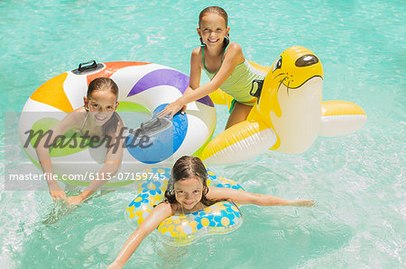 Girls playing together in swimming pool