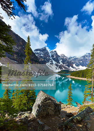 Snowy mountains overlooking glacial lake Snowy mountains overlooking glacial lake