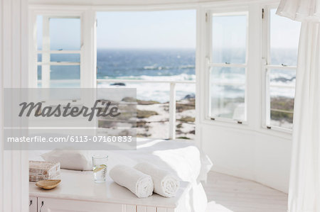 White bedroom overlooking ocean