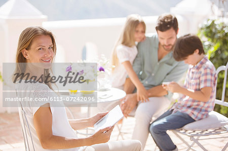 Family relaxing on patio Family relaxing on patio