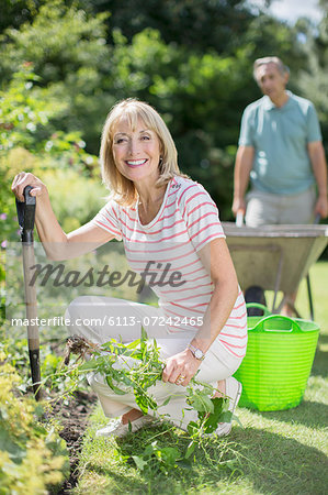 Senior couple working in garden