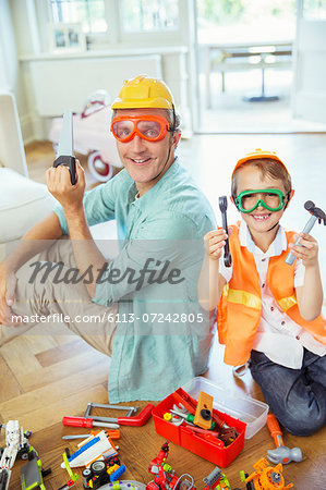 Father and son playing with construction toys