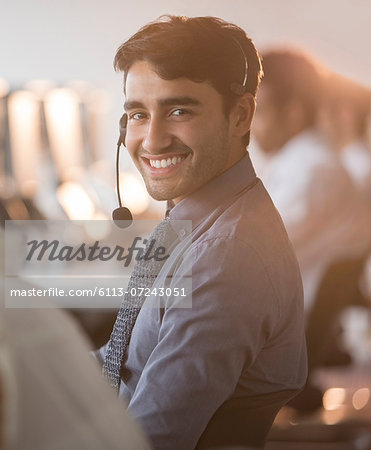 Businessman wearing headset in office