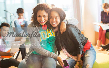 University students smiling together in lounge