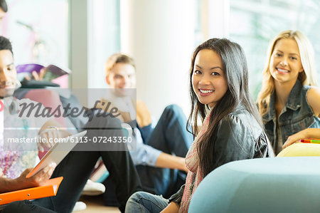 University students smiling in lounge