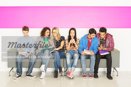 University students sitting on bench University students sitting on bench