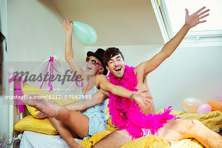 Couple having party in bedroom