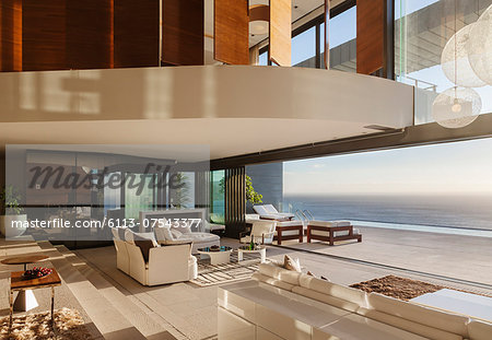 Living room in modern house overlooking ocean