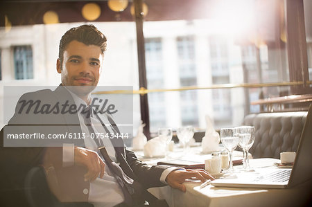 Businessman smiling in restaurant Businessman smiling in restaurant