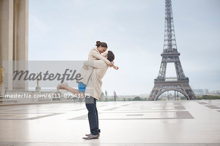 Couple hugging near Eiffel Tower, Paris, France - Stock Photo - Masterfile  - Premium Royalty-Free, Code: 6113-07543575