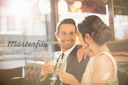 Couple drinking champagne in restaurant