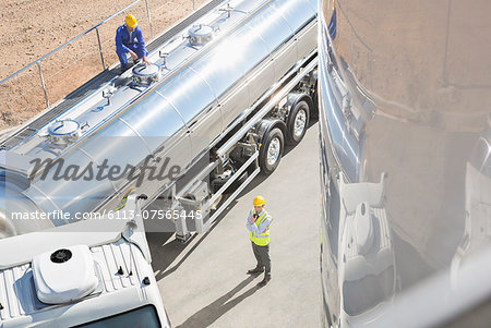 Workers around stainless steel milk tanker