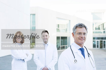 Portrait of confident doctors on rooftop