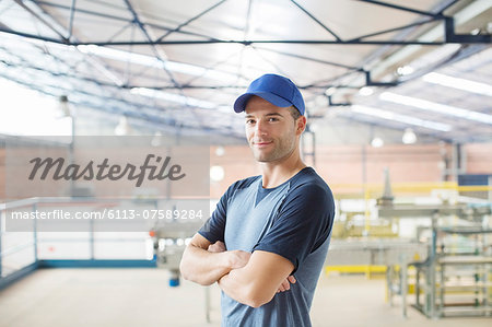 Portrait of confident worker in food processing plant