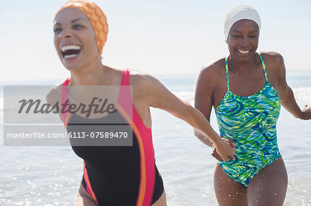 Enthusiastic lesbian couple at beach