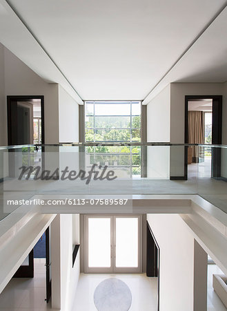 Modern balcony and open foyer in luxury home