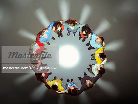 Diverse group around bright light Diverse group around bright light