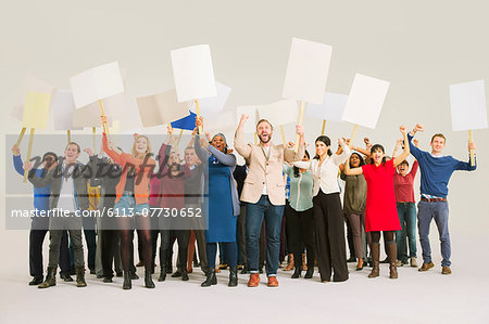 Diverse crowd with picket signs