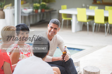 Friends talking at party