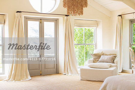 Front door and armchair in rustic house Front door and armchair in rustic house