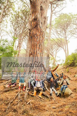 Teacher and students cheering in forest Teacher and students cheering in forest