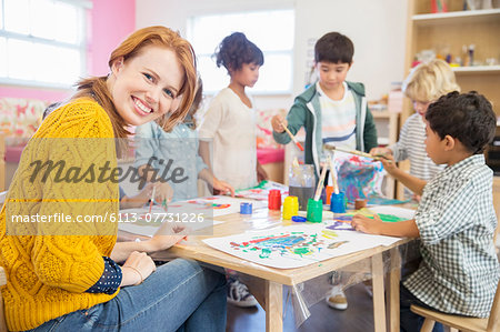Teacher and students painting in classroom Teacher and students painting in classroom