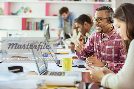 People working at conference table in office