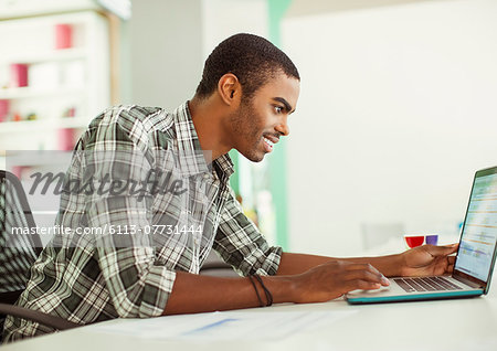 Man working on laptop in office