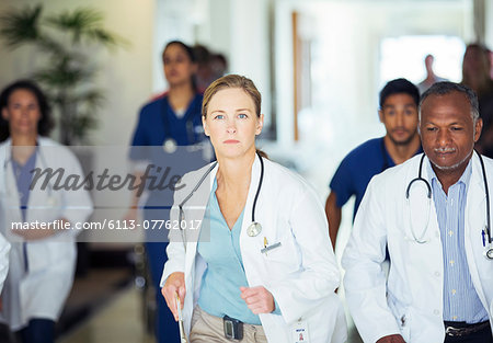 Doctors rushing in hospital hallway