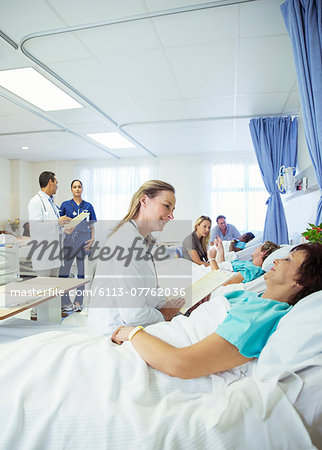 Doctor talking to patient in hospital room