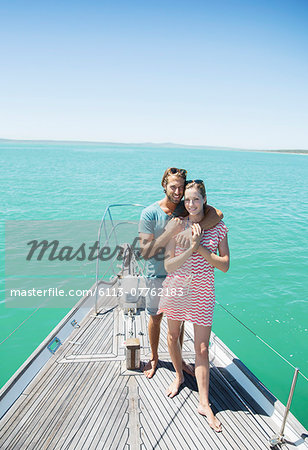 Couple standing on boat together