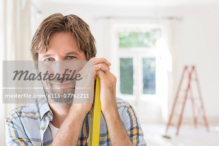Man smiling in living space