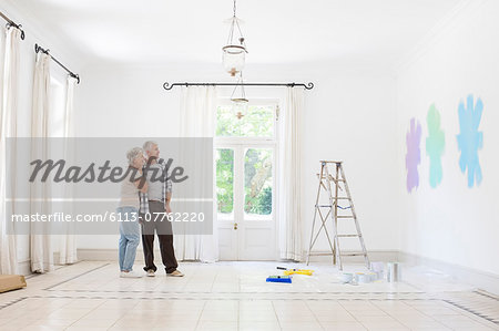 Older couple looking at paint swatches together