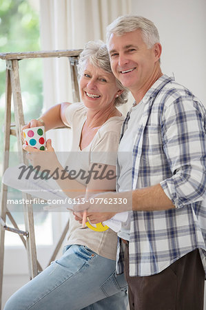 Older couple looking through documents together Older couple looking through documents together