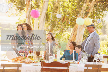 Gathered family looking down the garden