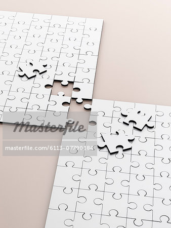 Close up of connecting puzzle with scattered pieces