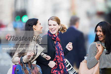 Women walking together on city street