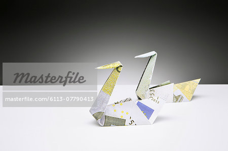 Origami Swans Made Of Euros On Counter Stock Photo