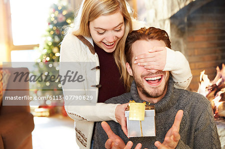 Couple exchanging gifts on Christmas Couple exchanging gifts on Christmas
