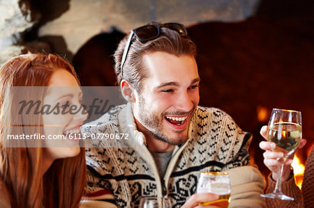 Couple enjoying drinks with friends
