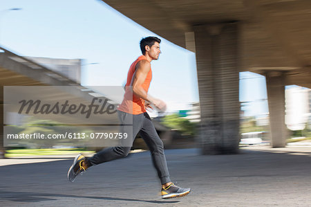 Man running through city streets