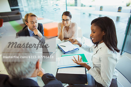 Business people talking at table in office building